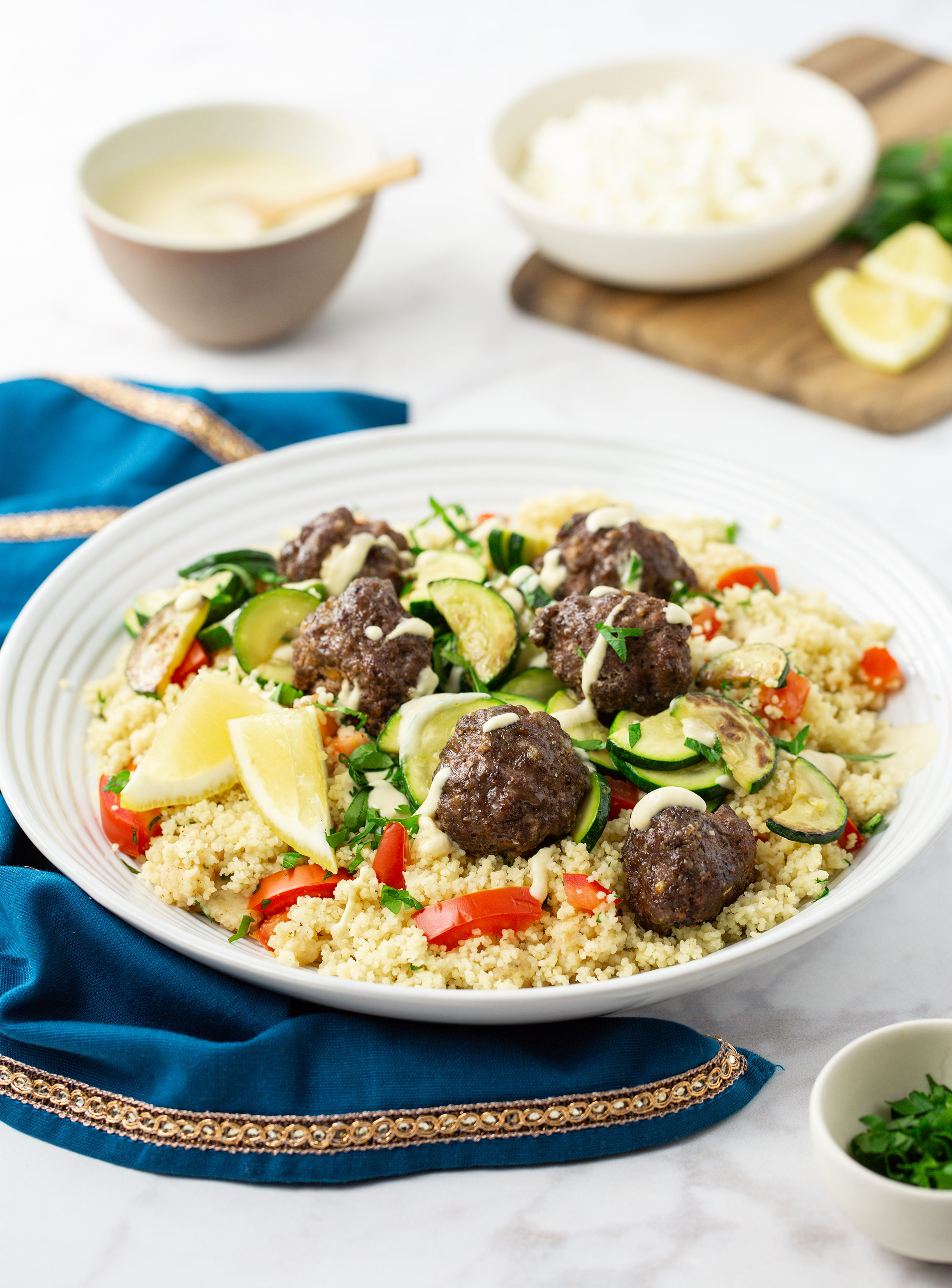 Lebanese Beef & Feta Meatballs with Zucchini, Couscous Tabbouleh and Hummus Drizzle