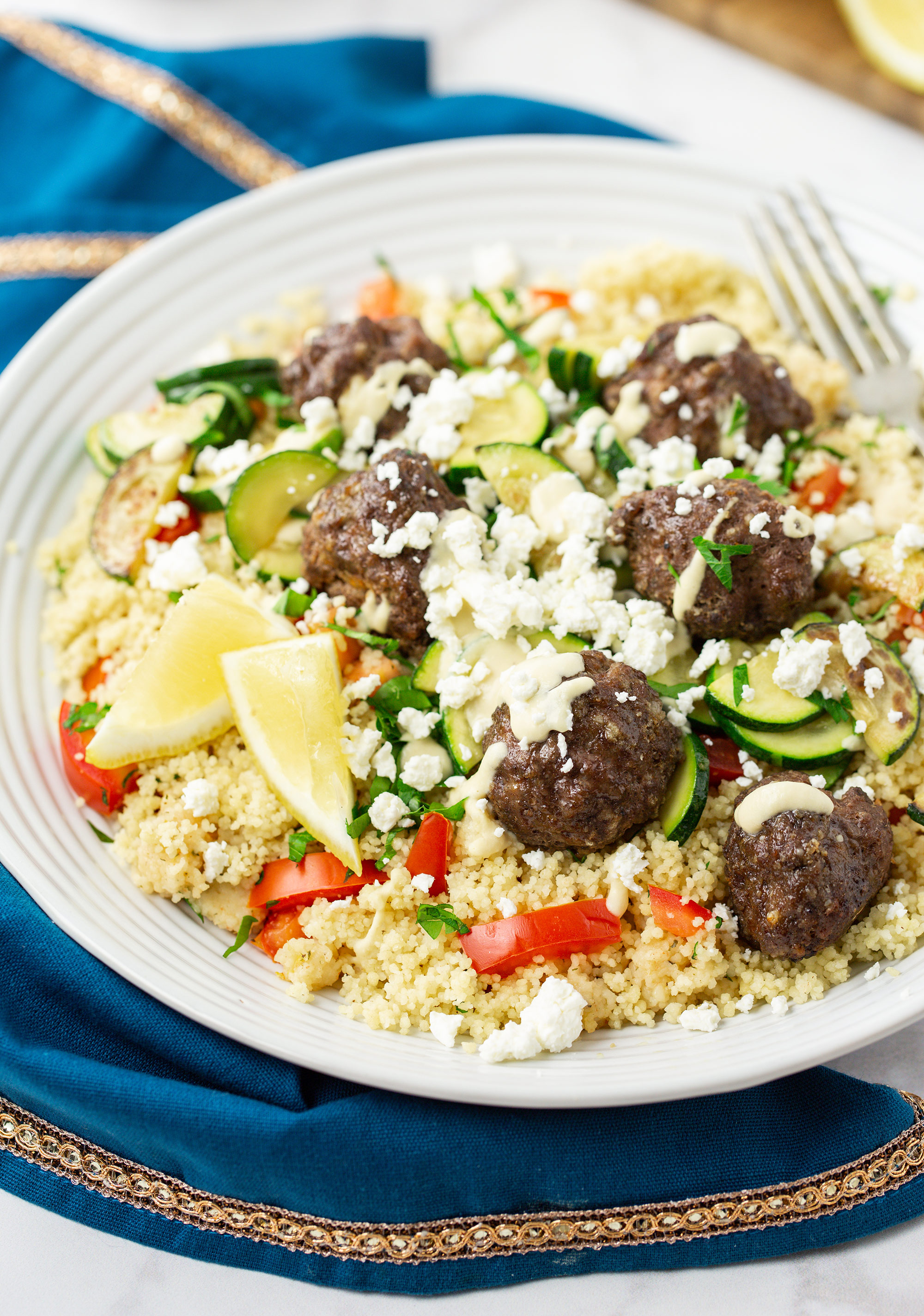 Lebanese Beef & Feta Meatballs with Zucchini, Couscous Tabbouleh and Hummus Drizzle